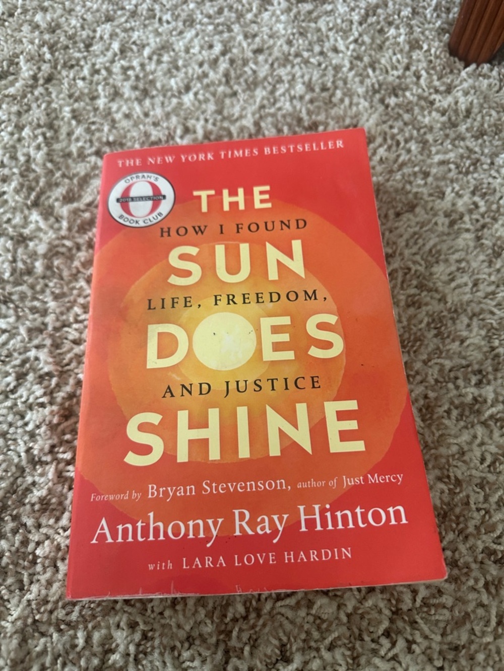 The Sun Does Shine by Anthony Ray Hinton - Bright Orange Paperback